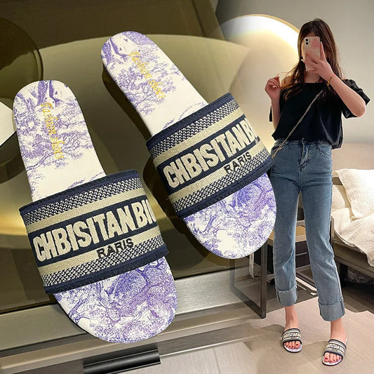 Slippers for women wearing on the outside, new round toe flat bottomed embroidered letter one line beach sandals for summer 2023